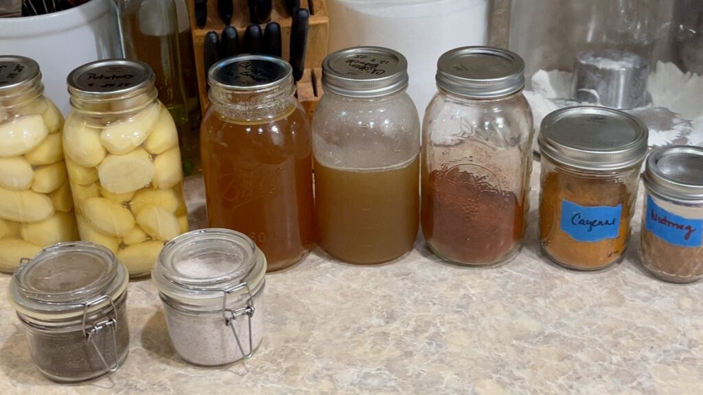 Some of the ingredients for the Loaded Potato Soup: potatoes, chicken stock, chili powder, cayenne, nutmeg