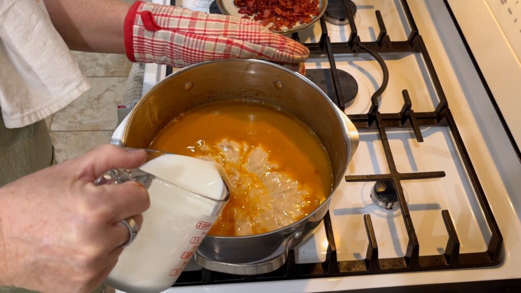 Add the milk and cream to the Loaded Potato Soup base.