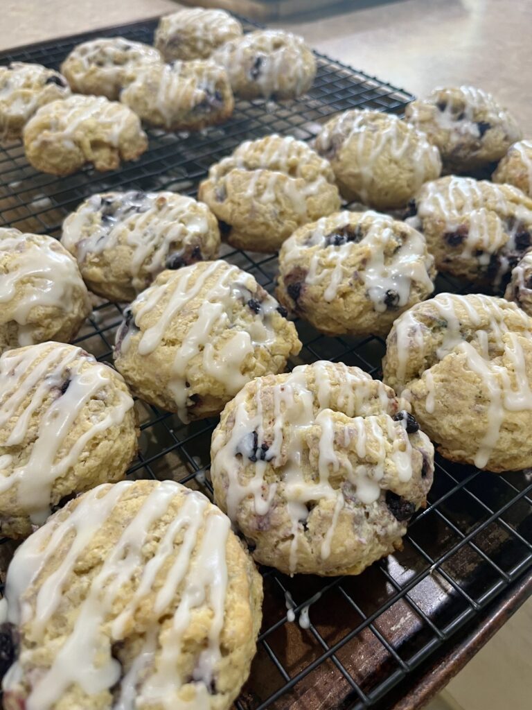 freshly iced blueberry scones on cooling racks